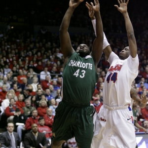 Shamari Spears (43) of Charlotte goes up strong against Josh Benson (44) of Dayton.