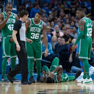 Boston Celtics Guard Marcus Smart (36) looks to the pleads the case to the ref of why Boston Celtics Forward Jaylen Brown (7) is laying on the court hurt versus Oklahoma City Thunder