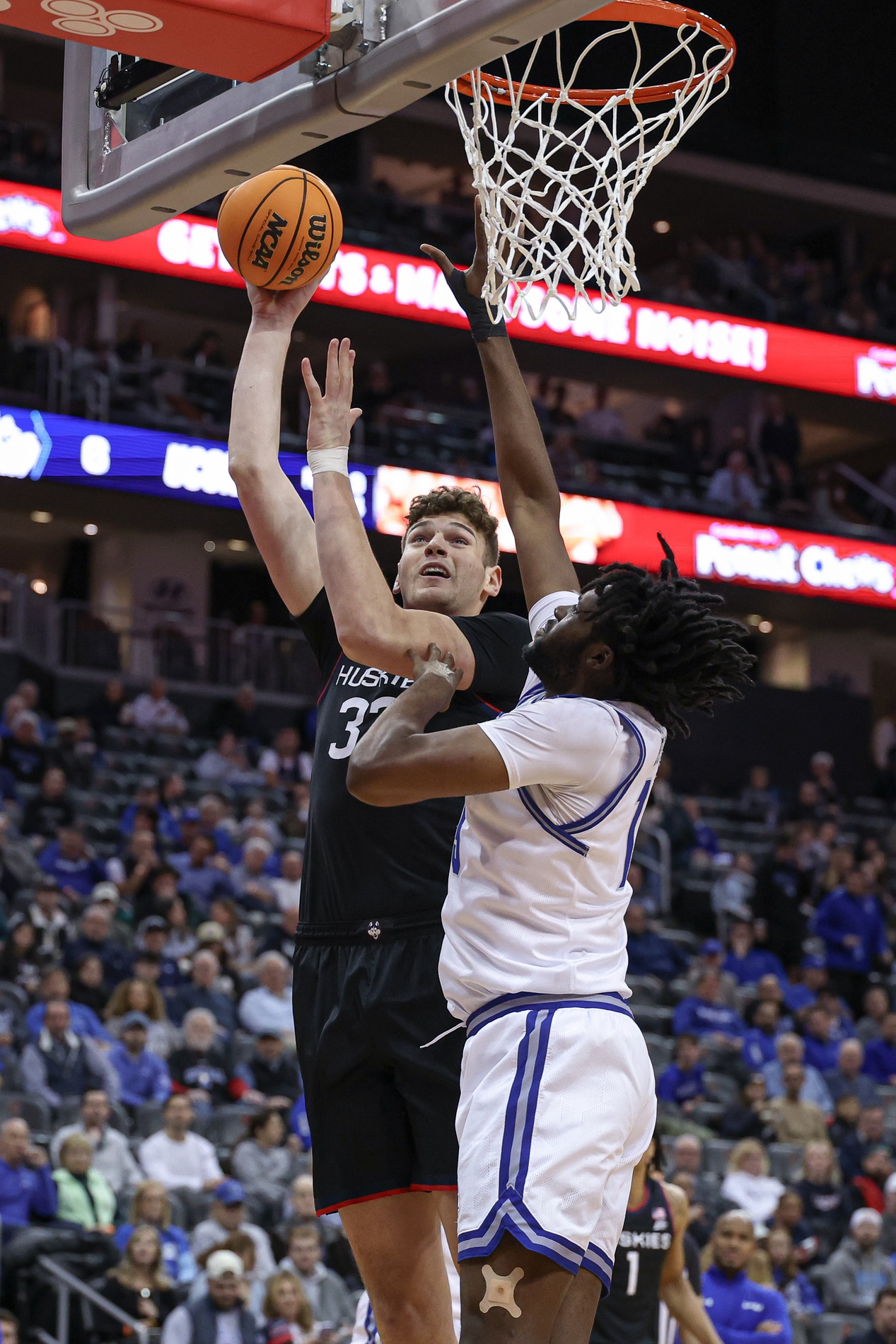 college basketball picks Donovan Clingan Connecticut Huskies predictions best bet odds