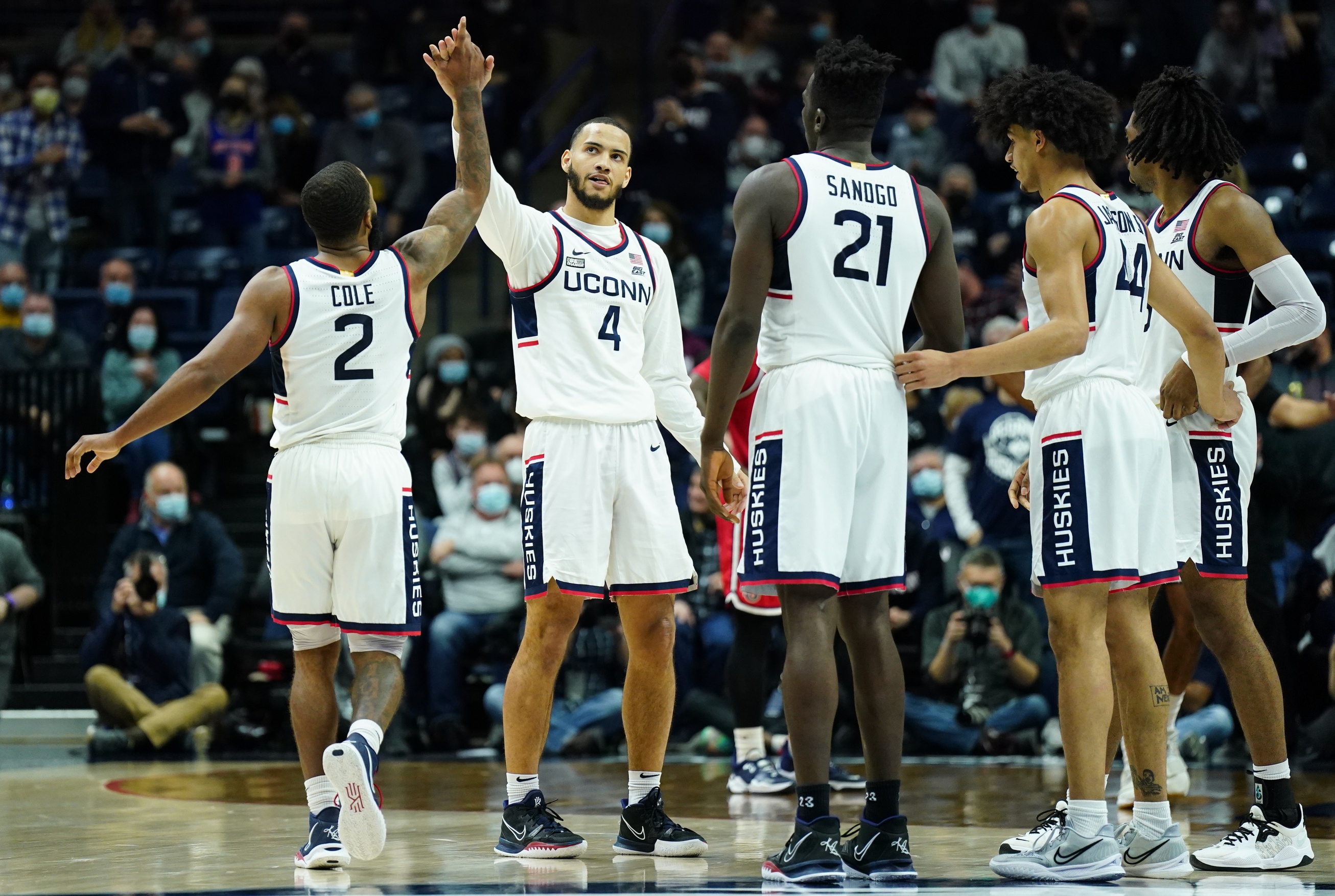 college basketball picks Tyrese Martin Connecticut Huskies predictions best bet odds