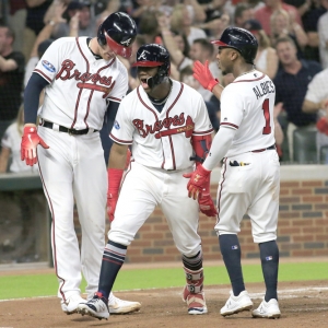 Atlanta Braves Outfielder Ronald Acuna Jr. (13) celebrates his grand-slam homer after crossing home plate during the Major League Baseball NLDS game between the Atlanta Braves and the Los Angeles Dodgers on October 7, 2018 at SunTrust Park in Atlanta, GA.