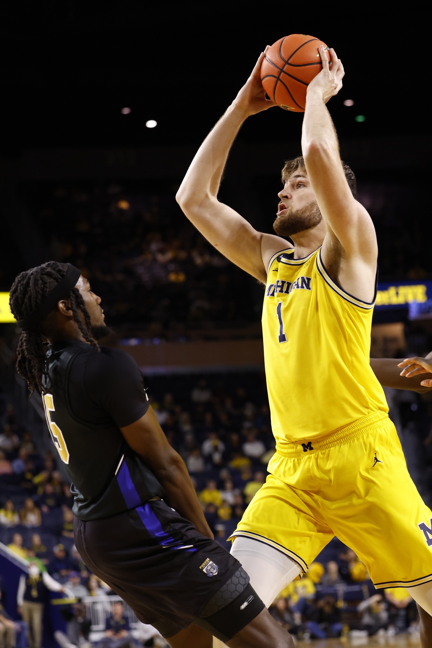 college basketball picks Hunter Dickinson Michigan Wolverines predictions best bet odds