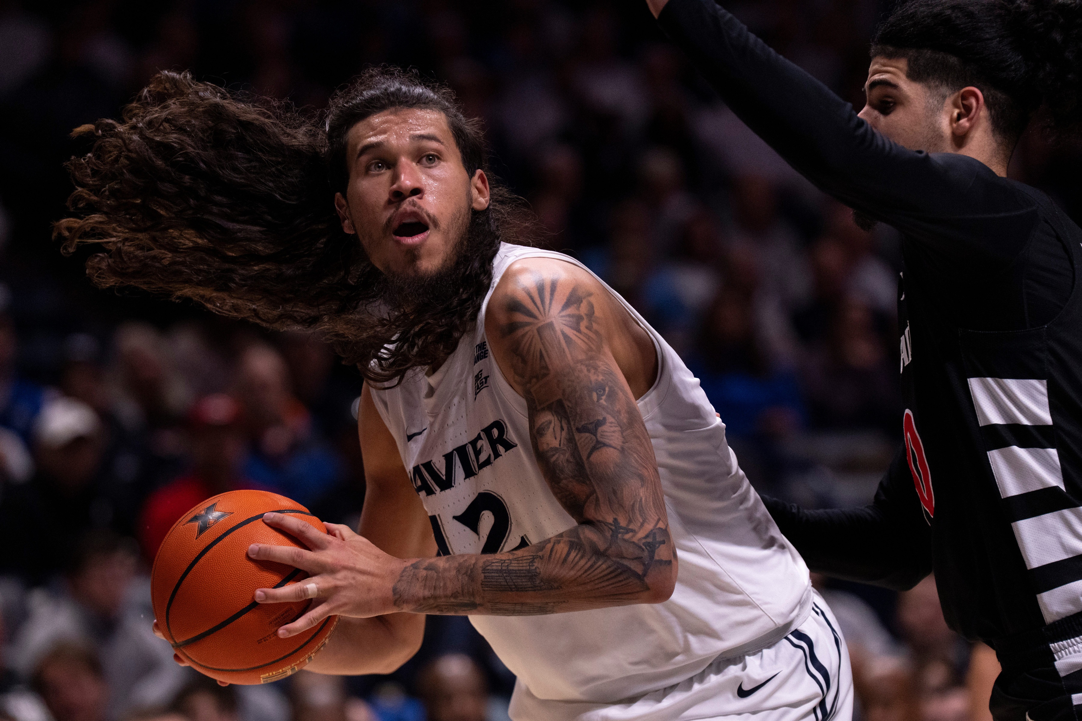 college basketball picks Tre Carroll Xavier Musketeers predictions best bet odds