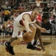 Steve Blake and Aaron Brooks battle for a loose ball in Game 1 of their 2009 playoffs series.